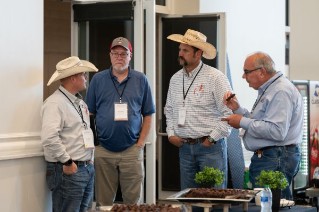 four men talking